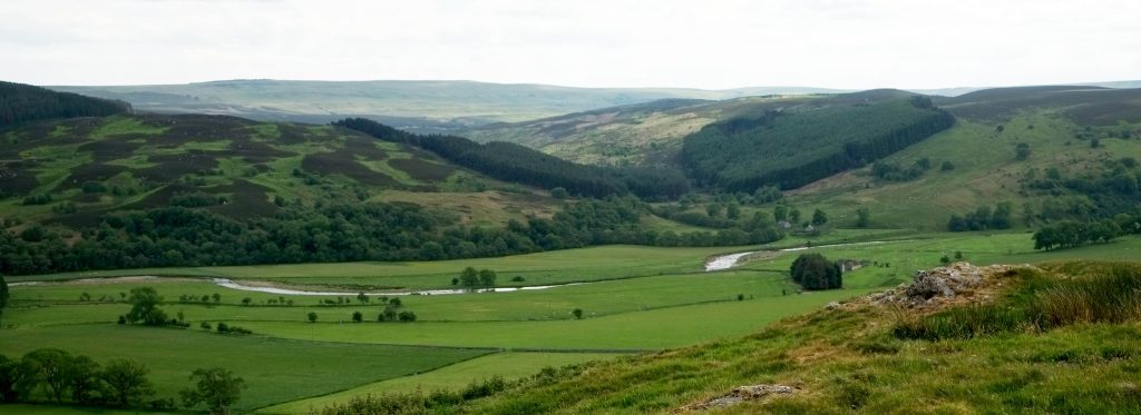 Photo showing a broad river-valley