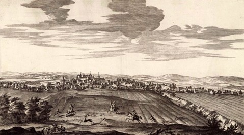 Engraving showing a town in the distance