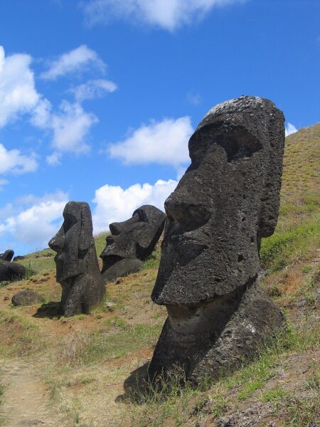 large stone-carved heads on a hillside