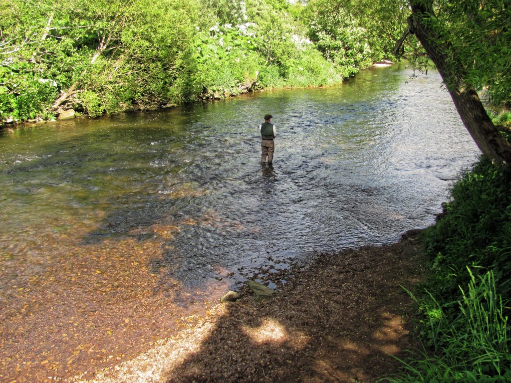 Shallow river with reddish bottom