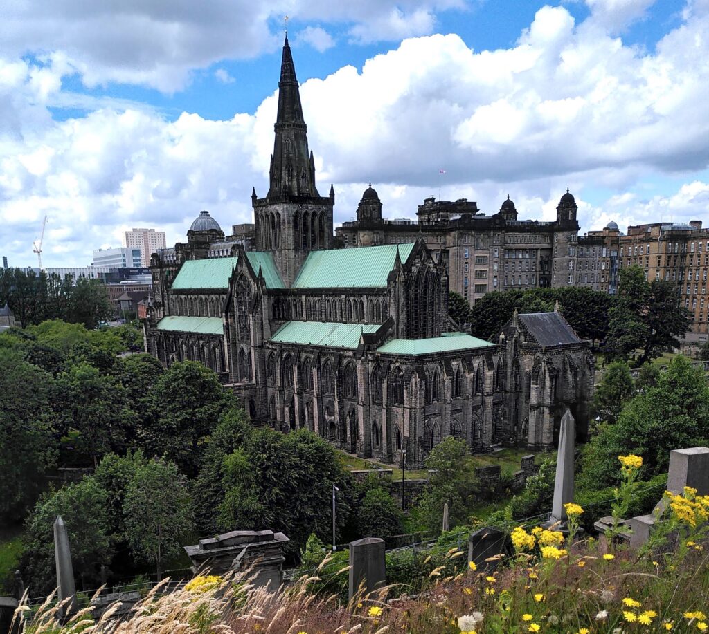 Glasgow cathedral seen from an adjoining hillside. There is a hollow between the cathedral and the hillside