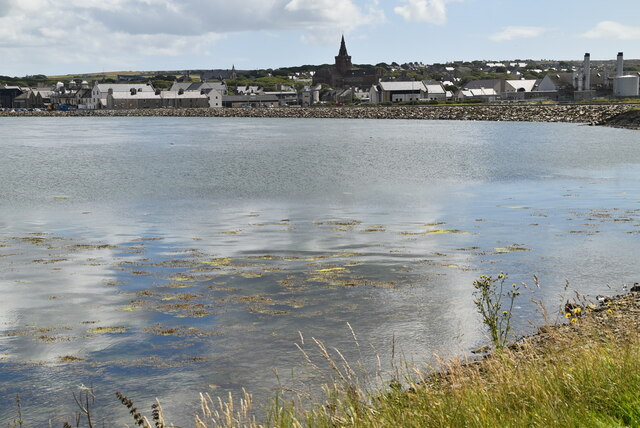 View looking over a bay wiht a church on the far side of the bay