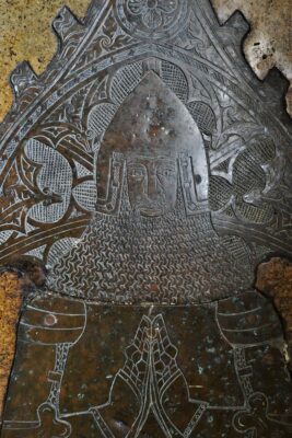 Brass of showing head and praying hands of Sir Nicholas Burnell, knight, dated 1382