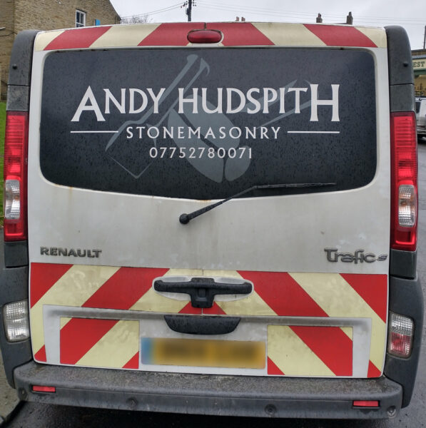 Back of tradesman's van showing surname Hudspith