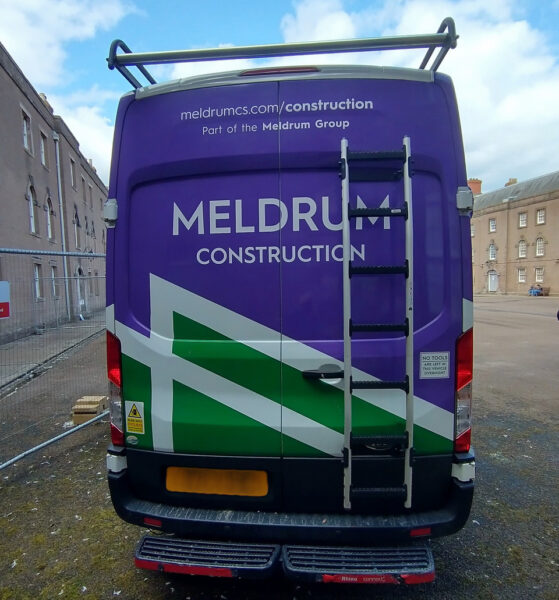 Rear of tradesman's van showing surname Meldrum